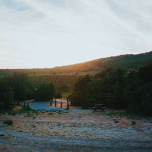 Ample space to set up your campsite, with neighbors in close proximity but plenty of bushes for privacy.