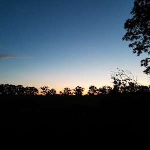 Sunset over the hay field on the last night