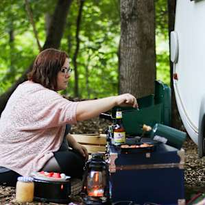 I made an outdoor kitchen and cooked dinner. We had sausage and sauerkraut with peppers and onions!