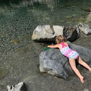 Splashing in the cool shallow water; No pincher bugs here!