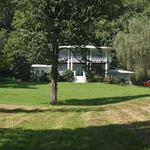 Field by the house, slight slope but lots of shade