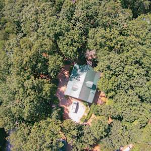 View from above. Most of the buildings and cabins are tucked away under the forest canopy.