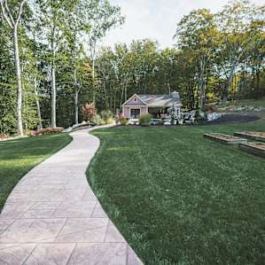 The pool house sits beyond the main house and offers privacy.