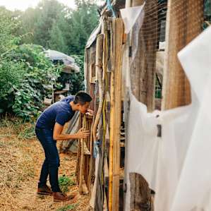 Checking out the makeshift greenhouse