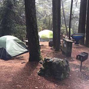 Campsites 10 & 11. Each has their own fire pit, grill, bench, locker, and water spout.