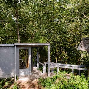 The Hawk's Nest is tucked down in the woods on the edge of a field.