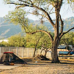 One site in the foreground, with another larger site back where the RV is parked