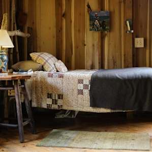 The single bed made with a handmade quilt!