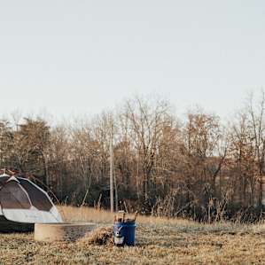 The tent spot is a small cut area in a field of tall grass. Firewood provide by the awesome hosts.