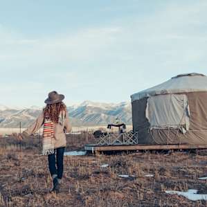 Happiness is a yurt with mountain views and camels for company.