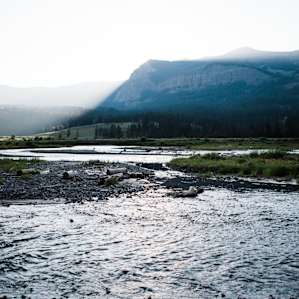 Light shining over the mountains surrounding Pebble Creek Campground. Lamar Valley.