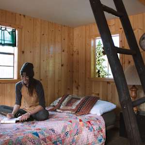 Futon-style couch also functions as a bed.