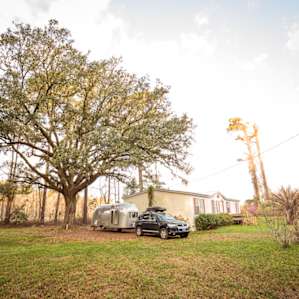 View of our trailer tucked in next to the AirBnB house.