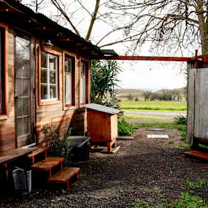 The bungalow on the left and the outdoor shower on the right