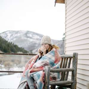 Porch sittin & coffee sippin! The front porch of the cabin offers spectacular views of the surrounding mountains.