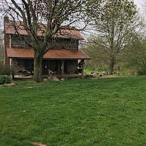 Old school cabin for rent with a great deck out back for cooking and relaxing, overlooking the creek.