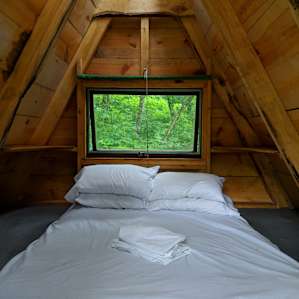 WOODEN TENT IN THE WOODS
