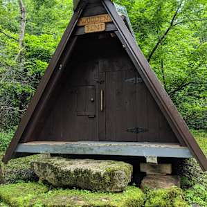 WOODEN TENT IN THE WOODS