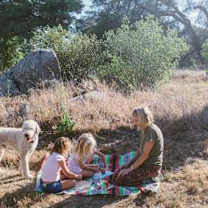 making friendship bracelets in the peaceful countryside