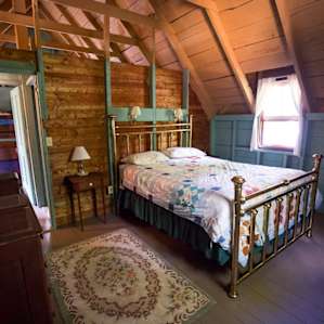 One of the three bedrooms upstairs. This one had a great view of the sun rising over the lake, flooding the window with early-morning light.