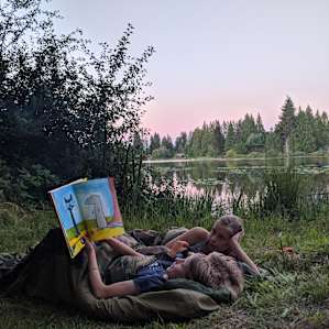 The kids slept outside next to the lake and loved it.