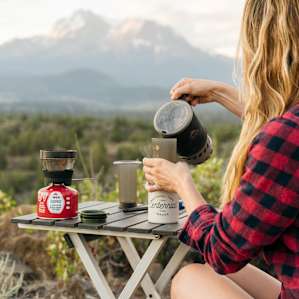 Morning coffee in camp with a mountain view