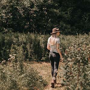 Walking through the raspberries and flowers!
