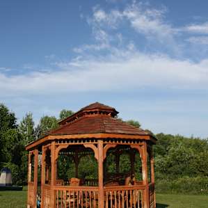Gazebo that had lounge chairs in it, conveniently located next to the water.