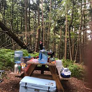Our (messy) kitchen set up - plenty of water was provided although we brought a gallon of dish washing water