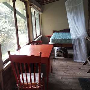 Front porch with a lovely place to sleep