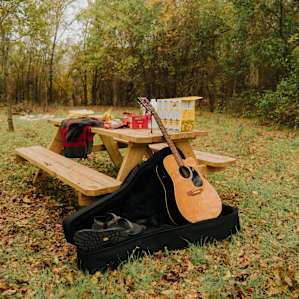 love the picnic table as the centerpiece of camp