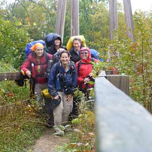 We made it! Crossing the suspension bridge on day 3 in the rain.