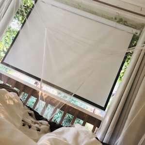 The screen and projector, Netflix available from bed