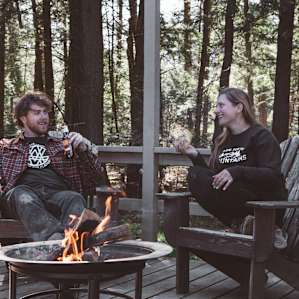 The patio off the back of the cabin provides a very relaxing spot to unwind with plenty of seating and a fire-pit.