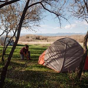 Setting up tent, on arrival.