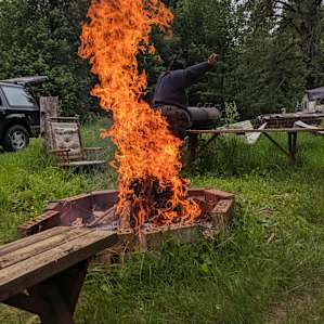 Wood + wind = epic fire to dance around!