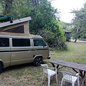Tucked behind the pool.