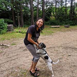 Maya with our dog, Winston, on the campsite