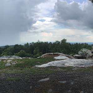 A view of rain crossing the valley below