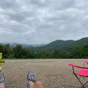 Sitting under our awning looking away from the camper to the front of our site and beautiful view.