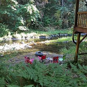 Secluded creekfront, wooded lot.