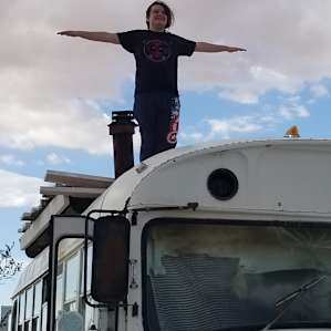 The best seat in the house is on top of the bus.