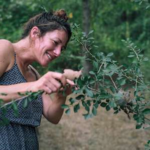 My friend nerding out on bugs and plants in the yard.