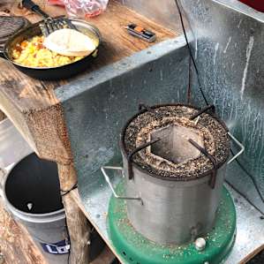 Little solar powered wood camp burner