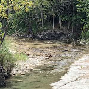 2 min away by car with good parking and 100ft upstream from bridge is this nice place to sit in the river and chill.
