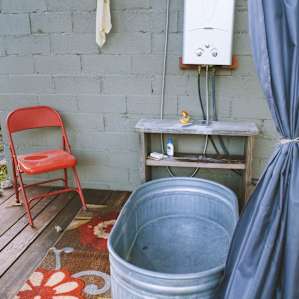 Rustic bathtub for bathing outside