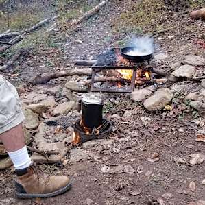 Coffee on the rocket stove, bacon on the fire...perfect start to a perfect morning.