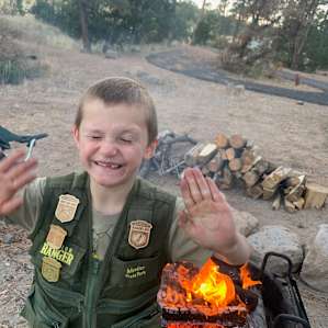 Fire after the junior ranger experience... fresh paved road in background.