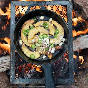 Winter camping dinner of acorn squash with malt vinegar, rosemary, feta, jalapenos