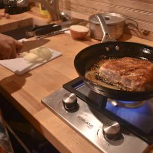 Cooking the amazing pork chops provided by Angela and Jesse